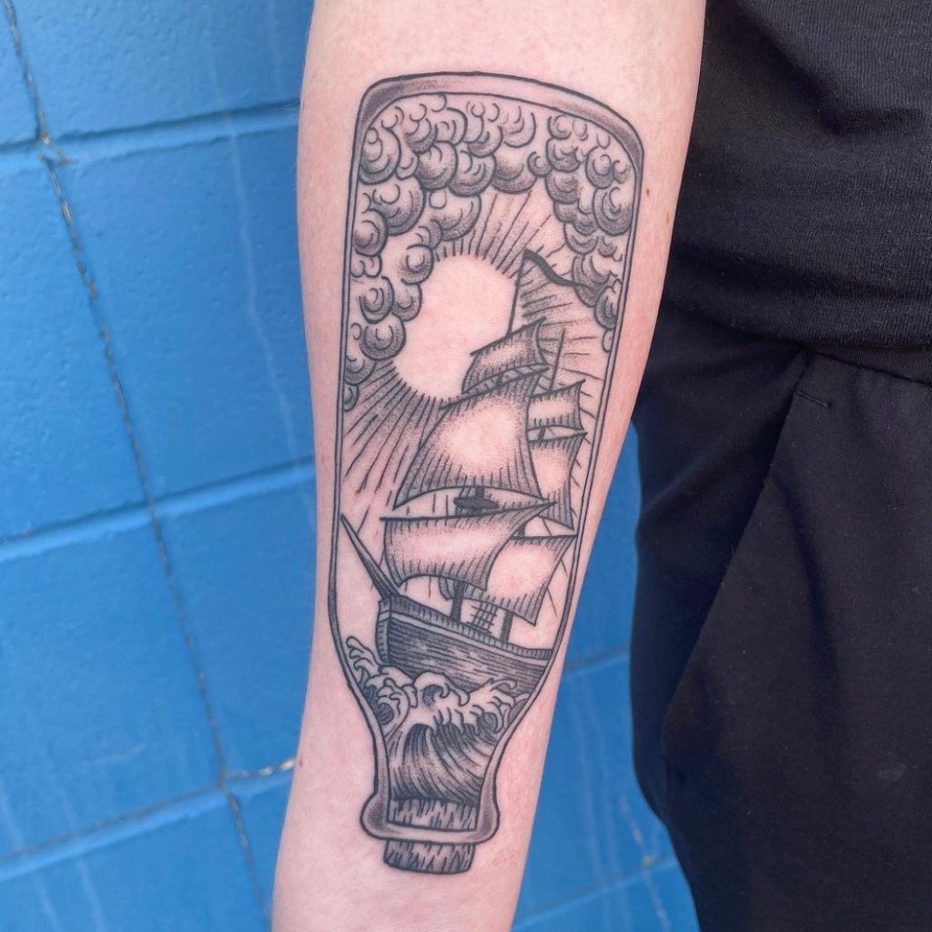 Photo of an illustrative tattoo by Wesley Pretty Tattoo in Sherwood Park Alberta, tattoo is of a ship in a bottle
