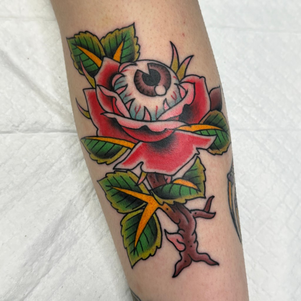 eyeball and rose tattoo